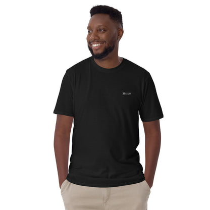 Men's Atlow Everyday Soft Tee streetwear in black worn by a man, showcasing minimalist design and comfort.